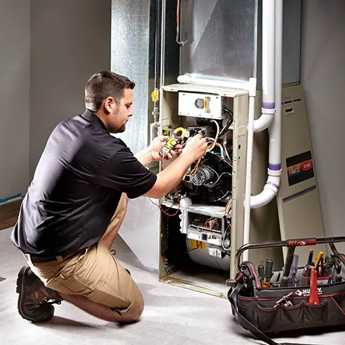 Contractor repairing a furnace