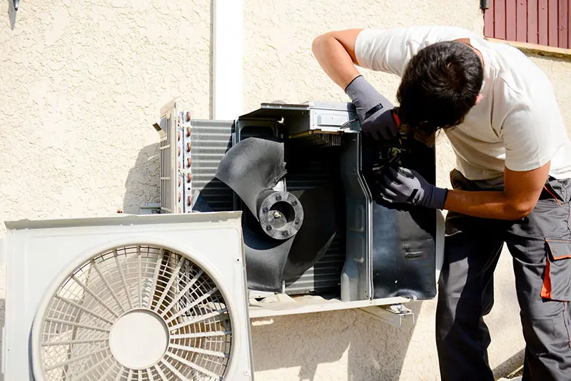 HVAC Specialist Installing Air Conditioner